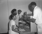 Professor explaining electrical equipment to students in a classroom at Tuskegee Institute in Tuskegee, Alabama.