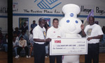 Lou Dantzler receiving a donation for the Challengers Boys and Girls Club, Los Angeles, 1996