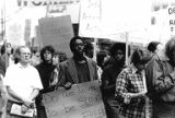 Bakke Decision Protest depicting people marching and holding protest signs in Seattle, Washington, 1977