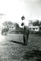 Arthur McCullough, Jr. Swinging a Golf Club