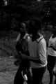 Edward Rudolph leading marchers down an unpaved road in Prattville, Alabama, during a demonstration sponsored by the Autauga County Improvement Association.