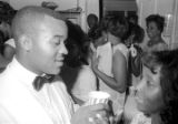 Susie Sanders Hubbard and her new husband, Freddie, sharing a cup during their wedding reception in her parents' home in Montgomery, Alabama.