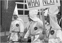 Klansmen marching in a parade during a Ku Klux Klan rally in Montgomery, Alabama.