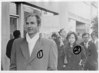 Mississippi State Sovereignty Commission photograph of Richard Johnson, Margaret Sue Barnes and Edward Lee Makamson (left to right) standing in front of a Western Union storefront with other unidentified demonstrators during an Anti-Vietnam War demonstration protesting Secretary of Defense Robert McNamara's visit to Jackson, Mississippi, 1967 February 24