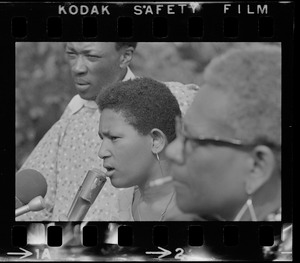 Unidentified woman, most likely a Black community leader or activist, speaking during Black student rally in Franklin Park