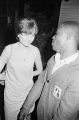 Patricia Gorence talking to Roosevelt Barnett of the SCLC, possibly during a nighttime civil rights demonstration in Montgomery, Alabama.