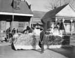 Children from the Lutheran School on a Mardi Gras float in an African American neighborhood in Mobile, Alabama.