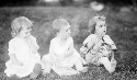 Ruth Davis (left), 2 years old, with two unidentified children