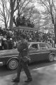 Car passing down the street during the funeral procession for Martin Luther King, Jr.