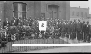 Group of men in front of church, with sign: "June 22 11 am Dr. L.K. Williams" : acetate film photonegative