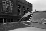 Damaged cars in the street outside of 16th Street Baptist Church in Birmingham, Alabama, after the building was bombed.