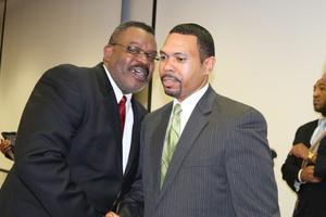 Two men talking at 20th Anniversary