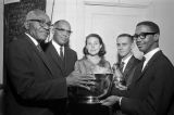 Presentation of an award from the Festival of Arts to Dr. L. H. Pitts at the Temple Theatre in Birmingham, Alabama, during a concert by Miles College students.