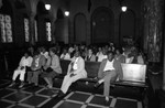 Robert Farrell's hearing participants listening to testimony on red lining, Los Angeles, 1985