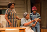 Dorcas Sowunmi, Kim Staunton and Lex Lumpkin in a scene from the play A raisin in the sun