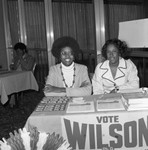 Black Publishers Association Conference attendees at a table with campaign paraphernalia