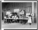 [Eight African American children, in kindergarten, learning washing and ironing at Whittier Primary School, Hampton, Virginia]