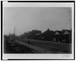 [Exterior view of houses along unpaved street in Georgia]