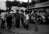 Dan Houser, Lula Williams, Richard Boone, and others, standing at the corner of Day Street and Greyhound Street in Montgomery, Alabama, during a civil rights demonstration.