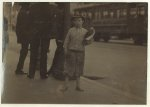 9 year old newsboy selling near Southern Pacific Depot. A negro bystander said: "He's de boss fighter of 5th Street." See California report.  Location: Los Angeles, California