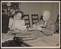 Grace Nail Johnson and Carl Van Vechten going over James Weldon Johnson's papers