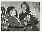 Mrs. Nixon joins the march Stuart Jacobs, 5, presents credentials to Mrs. Pat Nixon, wife of Vice President Richard Nixon, after she was named honorary chairman of the Mother's March of the National Chapter of the National Foundation in New York October 21.