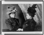 [Two African American women, half-length portrait, facing each other]