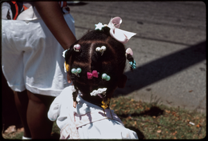 Atlanta, Georgia: 1988 West End Festival. Young African American girl's braids and hair decorations (parade spectators)