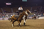 Members of the Westernaires, a Jefferson County, Colorado, organization that teaches and employs Roman-style riding (a rider standing atop two galloping horses) perform at the Martin Luther King, Jr., African-American Heritage Rodeo, one of the National Western Stock Show events in Denver, Colorado