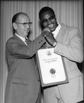 Kenneth Hahn welcoming Larry Holmes, Los Angeles