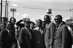 Tom Bradley posing with others during his mayoral campaign, Los Angeles, 1969