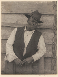 Man Leaning against a Wall