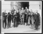 [Members of Congress posed, eating pie, left to right: Stewart Hoffman Appleby, Ralph Eugene Updike, William Radford Coyle, Samuel Dickstein, Edith Nourse Rogers, James Campbell(?) McLaughlin, Samuel James Montgomery, Clarence John McLeod, John Bartholomew Sosnowski, and Joseph Lawrence Hooper]