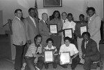 Bicentennial Bike Ride participants posing with Yvonne Brathwaite Burke, Los Angeles, 1976