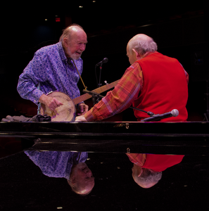 Pete Seeger talking with George Wein (on piano) at the Power of Song Award concert, Symphony Space, New York City