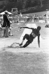 Carl Lewis completing a broad jump, Los Angeles, 1982