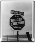 [Sign along road reading Grand Cafe and "Eat nigger chicken" in Vinita, Oklahoma]