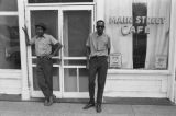 James "Son" Thomas and Joe Cooper, Leland, Mississippi. Street scene, cafe. (JTP 6-76-3)