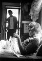 Josie Mae Jones sitting on a chair inside her home on Clayton Alley in Montgomery, Alabama.