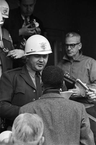 Sheriff Jim Clark talking to C. T. Vivian on the steps of the Dallas County courthouse during a voting rights demonstration in Selma, Alabama.