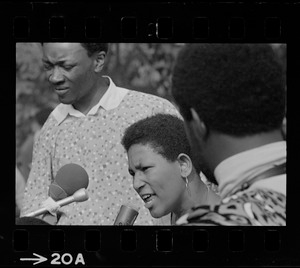 Unidentified woman, most likely a Black community leader or activist, addressing the crowd during Black student rally in Franklin Park
