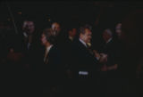 George and Lurleen Wallace walking through a crowd at a rally in the Municipal Auditorium in Birmingham, Alabama, during Lurleen's gubernatorial campaign.