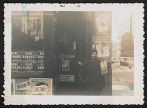 Woman outside storefront