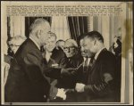 [President Lyndon B. Johnson gives Dr. Martin Luther King one of the pens used in the signing of the Voting Rights Act of 1965, in the background are Rep. Claude Pepper (center) and Rev. Ralph Abernathy]