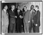 [Roy Wilkins standing with five other men]