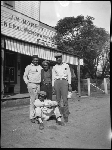 Four men in front of J.M. Morrin General Merchandise / Rumsey post office building