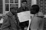 Scott B. Smith of SNCC speaking with Mike Bibler and John Davis of SCLC, in front of the Barbour County courthouse in Eufaula, Alabama.