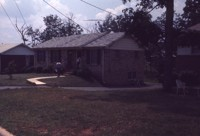 People Outside House in Northwoods Estates Neighborhood