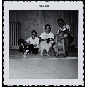 Three boys posing with their dogs at a Boys' Club Pet Show