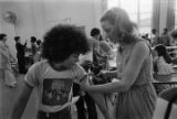 Boy getting an immunization shot at Sidney Phillips Middle School in Mobile, Alabama.